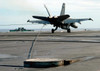 An F/A-18C Hornet makes an arrested landing on the flight deck of USS Enterprise Poster Print by Stocktrek Images - Item # VARPSTSTK101262M