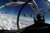 The refueling boom from a KC-135 Stratotanker arches over an F-15 Eagle as it refuels the aircraft Poster Print by Stocktrek Images - Item # VARPSTSTK102810M