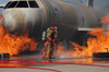 Airmen extinguish a fire on a training module to demonstrate an aircraft incident Poster Print by Stocktrek Images - Item # VARPSTSTK104025M