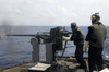 Gunner fires a Mark 38 machine gun aboard USS Frank Cable Poster Print by Stocktrek Images - Item # VARPSTSTK104754M