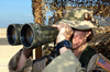 US Air Force Airman looks through a set of binoculars Poster Print by Stocktrek Images - Item # VARPSTSTK102379M