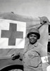 A World War II soldier stands next to his Red Cross vehicle Poster Print by Stocktrek Images - Item # VARPSTSTK106016M