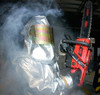 Airman handles a chainsaw during a smoke demonstration Poster Print by Stocktrek Images - Item # VARPSTSTK100665M