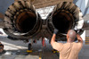 A maintainer inspects the engine of an F-15E Strike Eagle Poster Print by Stocktrek Images - Item # VARPSTSTK101386M