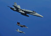 A F/A-18C Hornet flies near two F/A-18F Super Hornet aircraft during a mission Poster Print by Stocktrek Images - Item # VARPSTSTK103774M