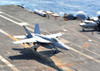 An F/A-18E Super Hornet lands aboard the aircraft carrier USS Enterprise Poster Print by Stocktrek Images - Item # VARPSTSTK103870M