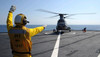 Boatswain??s Mate directs a CH-46 Sea Knight helicopter aboard USS Germantown Poster Print by Stocktrek Images - Item # VARPSTSTK105591M Boatswain??s Mate directs a CH-46 Sea Knight helicopter aboard USS Germantown Poster Print by Stocktrek Images - Item # VARPSTSTK105591M