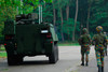 Belgian Infantry soldiers walk alongside the Piranha IIC armoured infantry vehicle Poster Print by Luc De Jaeger/Stocktrek Images - Item # VARPSTJAE100268M