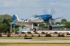 A P-51 Mustang takes off from Oshkosh, Wisconsin Poster Print by Rob Edgcumbe/Stocktrek Images - Item # VARPSTRDG100048M