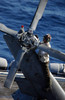 A crew member inspects an SH-60F Seahawk Poster Print by Stocktrek Images - Item # VARPSTSTK101710M