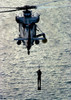 A search and rescue swimmer is hoisted aboard a  SH-2F Seasprite helicopter Poster Print by Stocktrek Images - Item # VARPSTSTK100231M