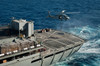 An MH-60S Sea Hawk conducts a vertical replenishment with USNS Rainier Poster Print by Stocktrek Images - Item # VARPSTSTK107603M