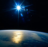 A star shining on planet Earth Poster Print by Stocktrek Images - Item # VARPSTSTK200556S