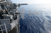 Sailors fire a 25mm machine gun aboard USS Bonhomme Richard Poster Print by Stocktrek Images - Item # VARPSTSTK106403M