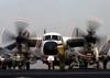 Airman directs the movement of a C-2 Greyhound on the flight deck of USS Harry S Truman Poster Print by Stocktrek Images - Item # VARPSTSTK100772M
