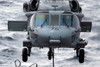 An MH-60S Seahawk helicopter descends on the flight deck of USNS Rainer Poster Print by Stocktrek Images - Item # VARPSTSTK101343M