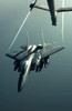 An F-15E Strike Eagle flies over Iraq after receiving fuel Poster Print by Stocktrek Images - Item # VARPSTSTK100647M