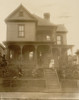 Home of an African American in Atlanta, Georgia, with man, woman & Boy in front of house Poster Print - Item # VARBLL0587632534