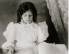 African American girl, half-length portrait, standing at table with illustrated book, facing slightly right Poster Print - Item # VARBLL0587634499