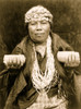 Hupa female shaman; Athapascan Hupa woman from northwestern California, half-length portrait, standing, facing front, wearing shell headbands, necklace, and holding up two baskets. Poster Print - Item # VARBLL058746860L