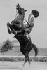Cowboy Rides Rearing Horse & Waves his Hat Poster Print by unknown - Item # VARBLL058745985L Cowboy Rides Rearing Horse & Waves his Hat Poster Print by unknown - Item # VARBLL058745985L