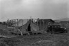 Family living in tent while building the house around them. Near Klamath Falls, Klamath county, Oregon. Poster Print by Dorothea Lange - Item # VARBLL0587241357