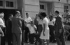 Vivian Malone, one of the first African Americans to attend the university, walks through a crowd that includes photographers, National Guard members, and Deputy U.S. Attorney General Nicholas Katzenbach. Poster Print - Item # VARBLL0587632607