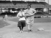 Male Baseball Player poses humorously with Girl Baseball Player Poster Print - Item # VARBLL058756598L