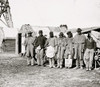 group of seven "contrabands" dressed in old Union uniforms standing in front of a wagon and shack. Poster Print - Item # VARBLL058753362L