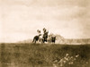 Three Sioux Indians of horseback on plains with rock formation in background. Poster Print - Item # VARBLL058746865L