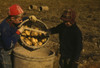 Two Children dump a bushel of potatoes Poster Print - Item # VARBLL058756637L