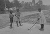 African American Children pretend to play golf on country road Poster Print - Item # VARBLL058746146L