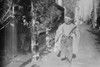 New Year's Greeting in Japan; Japanese man in Native dress walks down small street giving New Years Greetings Poster Print by unknown - Item # VARBLL058745871L