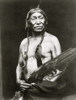 Bobtailhorse, Blackfoot Indian, half-length portrait, facing front, bare chested, holding large bird wing. Poster Print - Item # VARBLL058751200L