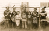 Seven Chilkat Indian men and boys posed, standing, full length, in native dress. Poster Print - Item # VARBLL058751172L
