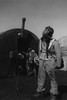 Photograph shows: Pilot Newman C. Golden, Cincinnati, Oh, Class 44-G, scanning the skies, with parachute room in background, Ramitelli, Italy. - Item # VARBLL0587244763