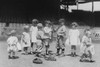 Uniformed and Non-Uniformed Toddlers on Baseball Field grasp a bat to select team members while young boys and girls look on Poster Print by unknown - Item # VARBLL058745869L