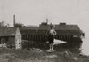 Fulsom McCutcheon, 11 years old, has been working at the covering machines in Eastport canning factory, also cutting some. In the background is a typical sardine factory. Poster Print - Item # VARBLL058755076L