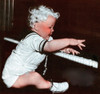 A Baby Plays a Piano Poster Print