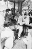 Enrico Caruso Leans back on chair holding a Board with Music; he is surrounded by adoring Crowds Poster Print by unknown - Item # VARBLL058745918L