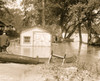 River overflows into garage; canoes set on the banks Poster Print - Item # VARBLL058750148L