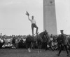 Cowboy Star Tim Mix stands on his horse, Eclipse, to the Thrill of Fans who come to the Washington Monument for the show Poster Print - Item # VARBLL058746358L