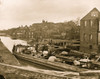 Richmond, Va. Barges with African Americans on the Canal; ruined buildings beyond; African American refugees on a boat with household belongings. Poster Print - Item # VARBLL0587631848