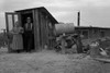 Mr. and Mrs. Wardlow at entrance to their dugout basement home. Dead Ox Flat, Malheur County, Oregon Poster Print by Dorothea Lange - Item # VARBLL0587241535