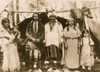 Native American men, women, and children standing in front of shelter, Warm Springs Reservation, Oregon. Poster Print - Item # VARBLL058751299L