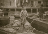 Truant hanging around boats in the harbor during school hours. Poster Print - Item # VARBLL058754420L