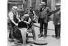 New York City Deputy Police Commissioner John A. Leach, right, watching agents pour liquor into sewer following a raid during the height of prohibition Poster Print by unknown - Item # VARBLL0587245751