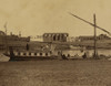 Several men on boat docked at water's edge, temple ruins of ancient Thebes in background, Luxor, Egypt. Poster Print - Item # VARBLL058754029L