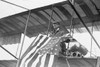 Aviator C.B. Harmon Unfurls Stars and Stripes from his pilot seat on his Biplane. Poster Print - Item # VARBLL058746052L