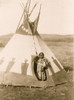 Piegan girl standing in doorway of tepee, wearing beaded buckskin dress, Montana. Poster Print - Item # VARBLL058747513L